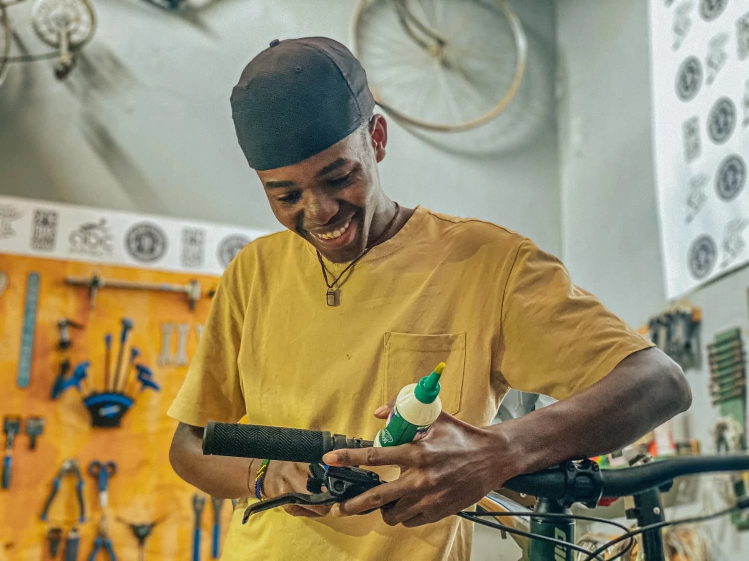 A One Bike mechanic servicing a bike at the workshop in Moshi